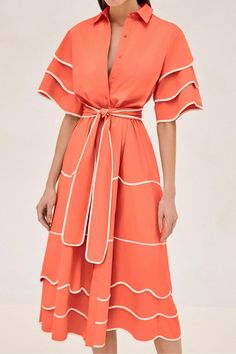 Find ALEXIS Rhodes Midi Dress on Editorialist. The Alexis Rhodes Midi Dress features a classic shirt dress silhouette with a playful, layered trim detailing. This midi dress has a flattering waist tie to accentuate the figure. The dress has a collared neckline, button closure, and short sleeves. Orange Midi-length Dress With Ruffles, Orange Midi Dress With Ruffles, Orange Ruffled Midi Dress, Chic Orange A-line Midi Dress, Elegant Orange Midi Dress With Short Sleeves, Elegant Orange Short Sleeve Midi Dress, Orange Ruffled Midi Dress For The Beach, Chic Orange Dresses With Ruffles, Orange A-line Dress For Brunch