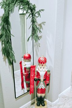 two nutcrackers are standing in front of a mirror