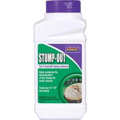 a bottle of stump - out disinfectant sits on a white surface with a purple cap