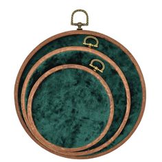 three pieces of green velvet with gold trimmings on each side and an oval wooden frame in the middle