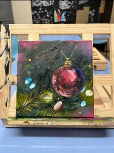 an acrylic painting of a christmas ornament