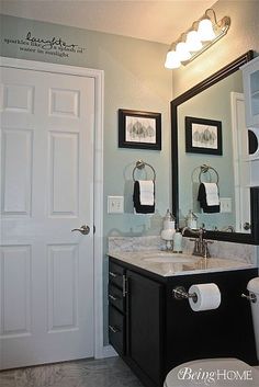 a white toilet sitting next to a bathroom sink