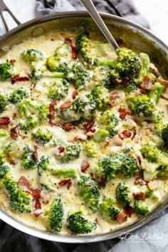 a pan filled with broccoli and cheese on top of a table