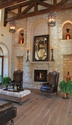 a living room with two chairs and a fire place in the middle of the room