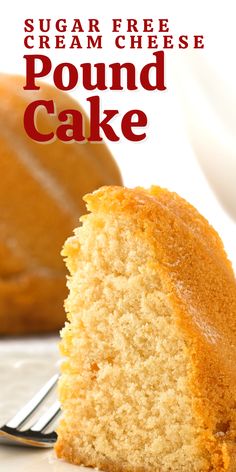 a piece of pound cake on a white plate with a fork and the rest of the cake in the background