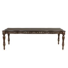 a wooden table with an ornate design on the top and legs, against a white background