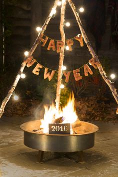 a happy new year fire pit with lights