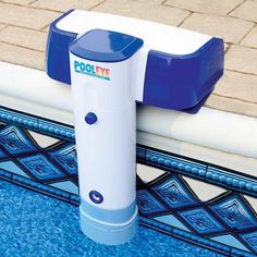 a blue and white device sitting on the edge of a swimming pool