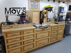 a workbench with many drawers and tools on it