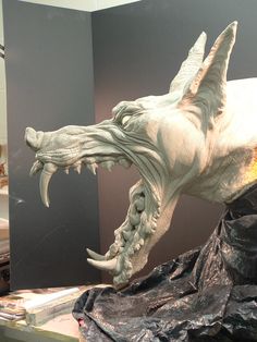 a sculpture of a dragon with its mouth open