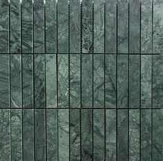 green marble tile with vertical lines in the center and diagonals on each side, forming an abstract pattern