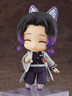 an anime figurine is posed on a clear base with purple hair and black eyes