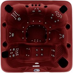 a hot tub that is red and has white dots on the sides, with four jets