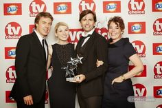 three people posing with an award at the tv choice awards