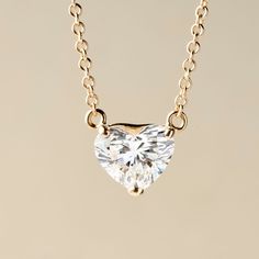 Add some dazzling romance to your style with this lovely 1.00 or 2.00 carat heart-shape lab-grown diamond necklace from Peace Jewelers. You'll love the gorgeous sparkle on your neckline! The piece is finely crafted in your choice of rich 14K yellow or white gold with a polished finish. The 18" cable link chain secures with a lobster clasp. Pair it with matching earrings 215-188 to create a stunning coordinated style. Heart Necklace Diamond, Diamond Necklaces, Necklace Size, 2 Carat, Necklace Sizes, Diamond Heart, Heart Shape, Link Chain, Matching Earrings