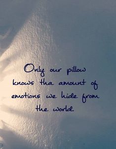 a quote written in blue ink on a white paper with the words only our pillows knows that amount of emotions we hide from the world