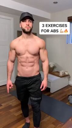 a shirtless man standing on top of a hard wood floor