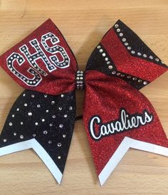 Red and black glitter cheer bow with rhinestones Cheer Bows With Rhinestones, Cheer Bow Rhinestone Template, Red And Black Cheer Bows, Cheerleader Bows Diy, Cheer Bow Design Ideas, Cute Cheer Bow Ideas, Football Cheer Bows, Cheer Bow Designs, Cheerleading Bows Diy