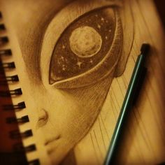 a pencil drawing of a woman's face with an eyeball in the center