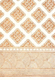 an ornate gold and white wallpaper pattern