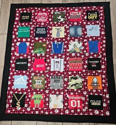 a red and black quilt with lots of different items on the front, including t - shirts