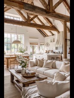 a living room filled with furniture and lots of windows