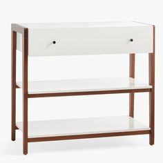 a white wooden shelf with two drawers