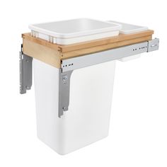 When it comes to home decor, your trash container can pose a challenge. If space and aesthetics are an issue, then you need the Rev-A-Shelf 50 qt. Top Mount Pullout Trash Container Bin. Enjoy the convenience of simply pulling out your waste bin to dispose of anything in your kitchen, without having to worry about it being exposed in your kitchen. This is an easy to install design for a no-fuss setup designed for a cabinet opening of exactly 12''. These waste containers are designed for absolute sturdiness with front and rear adjustable mounting, pre-installed Door Mount brackets, and full-extension 150 lb. rated ball-bearing slides for total stability. This trash container’s modern maple exterior even complements your kitchen while the durable finish lasts the long haul. Enjoy a spacious, Maximize Kitchen Space, Pull Out Trash Cans, Face Frame Cabinets, Frameless Cabinets, Wood Waste, Trash Containers, Your Trash, Framed Cabinet, Rev A Shelf