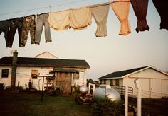 clothes hanging on a line over a yard