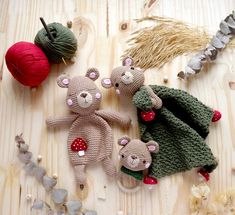 crocheted teddy bears and balls of yarn on a table