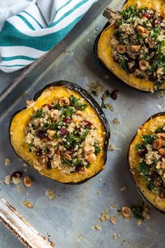 baked stuffed acorns with nuts and herbs on a baking sheet, ready to be eaten