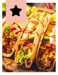 three tacos on a wooden platter with toppings