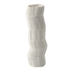 a white vase with wavy lines on the bottom is shown in front of a white background