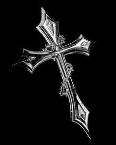 a silver cross on a black background