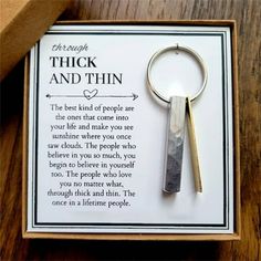 there is a keychain with a poem in it on the box that says, thick and thin