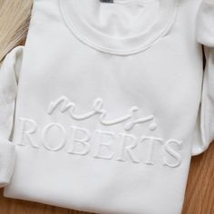 Mrs Sweatshirt Bride Sweatshirt Personalized Bride Sweatshirt Embossed Mrs Last Name Sweater Honeymoon    DETAILS    Our Engagement Gifts sweatshirt boast an exceptional level of softness and comfort - This Bride Sweatshirt is SO COZY! Designed as unisex apparel, for our Mrs Sweatshirt, we recommend reviewing our size chart to guarantee the accurate selection of your preferred size - for a loose fit, we suggest sizing up. Please note - the more characters your personalization has, the smaller th Brides Gift From Groom, Bridesmaids Gift Ideas From Bride, Mrs Sweatshirt Brides, Custom Bride Gifts, Christmas Gifts For Bride To Be, Outfits To Get Engaged In, Future Mrs Sweatshirt, Bachelorette Sweatshirt Ideas, Machine Embroidered Gifts