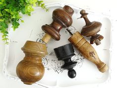 three wooden chess pieces on a white tray