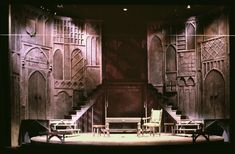 an empty stage with chairs and stairs