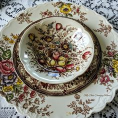 an ornately decorated plate with flowers on it