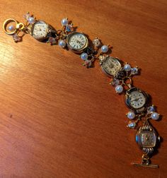 "FUN! This is a bracelet made from vintage watches dating from the 1930s and up. There are a variety of watches used; this one includes Helzberg 10k RGP, Benrus 10k RGP, Devon 10k RGP and Bulova 10k RGP. I just love the different shapes of the watches! I've used faux pearls and clear crystals in this bracelet.  The bracelet measures about 1/2\" wide and 7.25\" long but can be shortened or lengthened to your specifications, simply send me a message. Each of my pieces are one of a kind, unique pie Jewelry Made From Old Watches, Luxury Vintage Handmade Watch Accessories, Vintage Bracelet Watch, Cool Watches Unique, Repurposed Watches, Button Choker, Victorian Steampunk Wedding, Unique Pies, Watch Bracelets