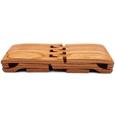 a wooden cutting board with four sections cut out