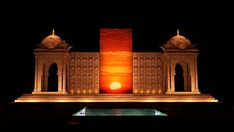 the sun is setting in front of a building with arches and domes on it's sides