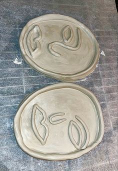 two pie pans sitting on top of a counter