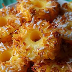 pineapples with coconut sprinkles on a plate