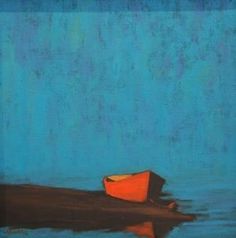 an orange boat floating on top of a body of water next to a blue wall