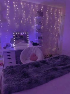 a bedroom decorated in purple and white with lights