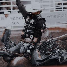 a man riding on the back of a brown horse