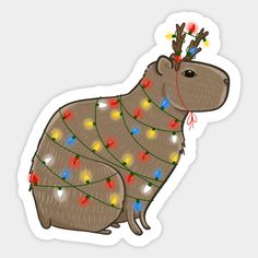 a brown animal with christmas lights on its head