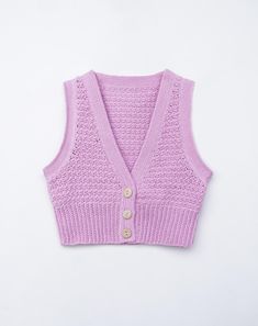 a pink knitted sweater vest with buttons on the front and back, against a white background