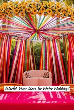 a bed with sunflowers on it in the middle of a canopy decorated with ribbons and flowers